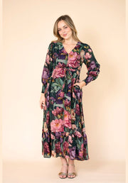 Estelle Print Maxi Dress by Fria The Label — full-length front view of dark floral maxi dress with bold peony print, v-neckline with gold buttons, drawstring waist and tiered hem, styled with gold heels, available in Australia at Kat and Ko Clothing
