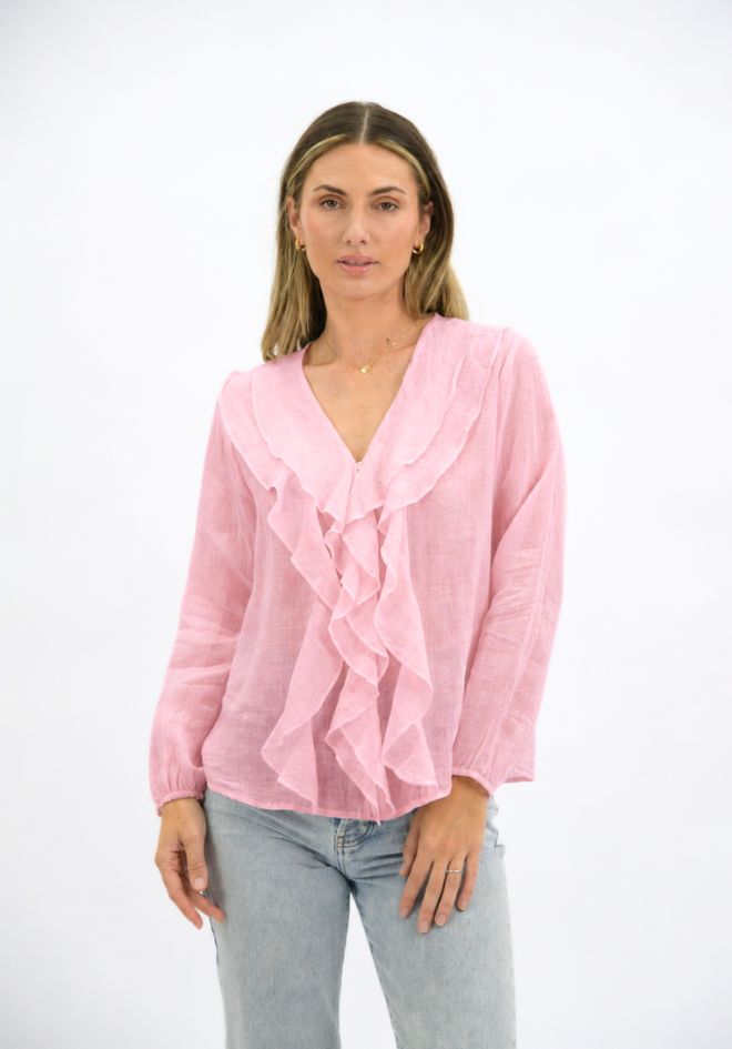 Claire Linen Blouse by Worthier — front view of dusty pink 100% linen blouse with cascading ruffle frill detail and v-neckline, styled with light wash jeans, available in Australia at Kat and Ko Clothing