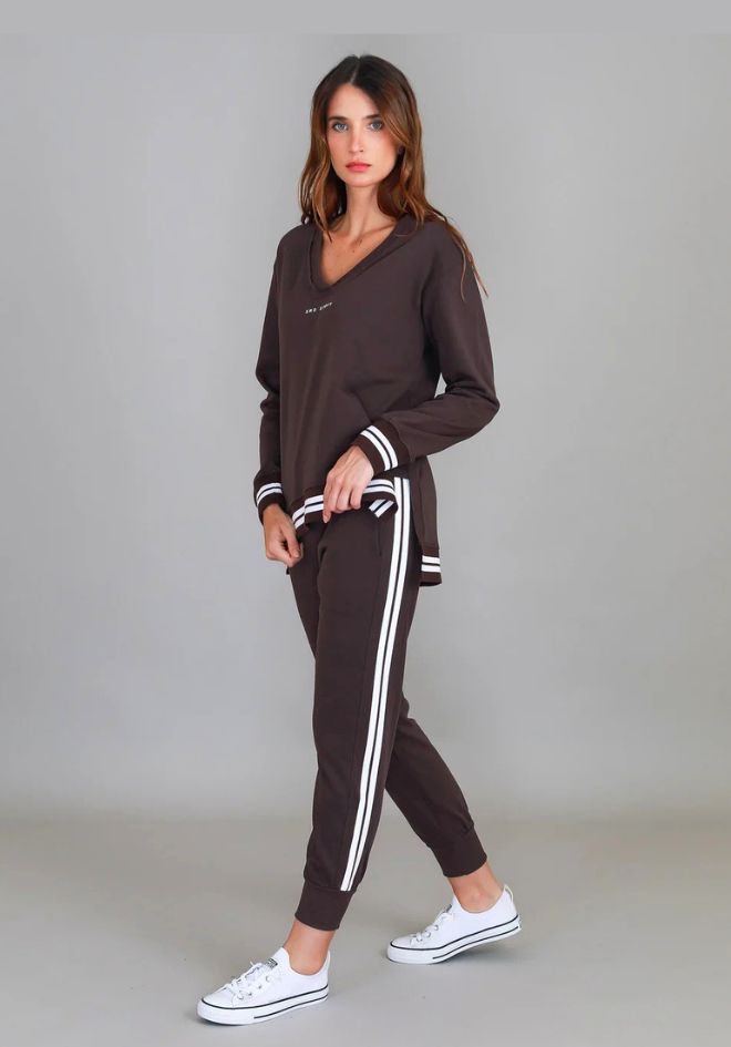 3rd Storey The Label Pammy Sweatpants in Truffle — side view showing logo stripe, styled with matching top and white sneakers, shop in Australia at Kat and Ko Clothing