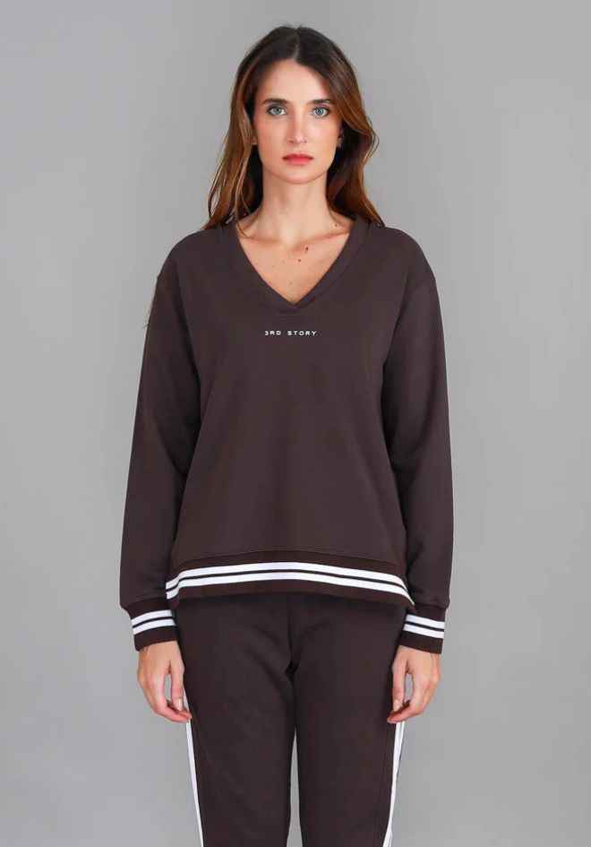 3rd Story The Label Pammy 3S Logo Sweater Truffle — full-length front view of relaxed V-neck sweatshirt with white-striped rib hem and cuffs, styled as a matching tracksuit set with truffle jogger pants, shop in Australia at Kat and Ko Clothing