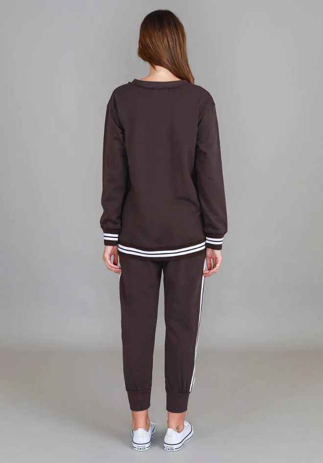 Pammy 3S Logo Sweater Truffle 3rd Story The Label — back view of oversized truffle brown sweatshirt with white-striped rib hem, styled as a matching set with truffle jogger pants, available in Australia at Kat and Ko Clothing
