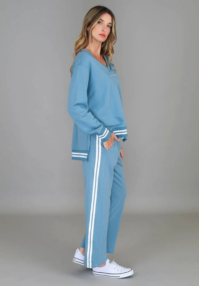 3rd Storey The Label Pammy Stripe Sweatpants in Cloud Blue — side view styled with matching top and white sneakers, shop in Australia at Kat and Ko Clothing