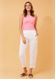 Sorrento Linen Pants by Bottega Moda — full-length front view of white linen pants with a relaxed fit, styled with a pink halter top and printed slide sandals, shop in Australia at Kat and Ko Clothing