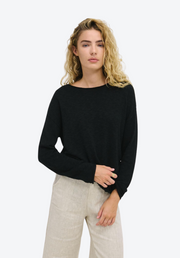 Nellie Top Black by Little Lies — relaxed fit black cotton long sleeve top, front view styled with wide-leg pants, available in Australia