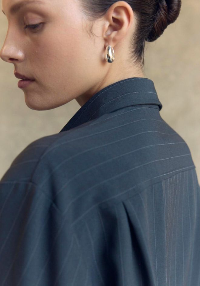  Little Lies Penelope Tie Bomber Shirt — charcoal grey tie bomber shirt styled with straight-leg jeans for an effortless casual look