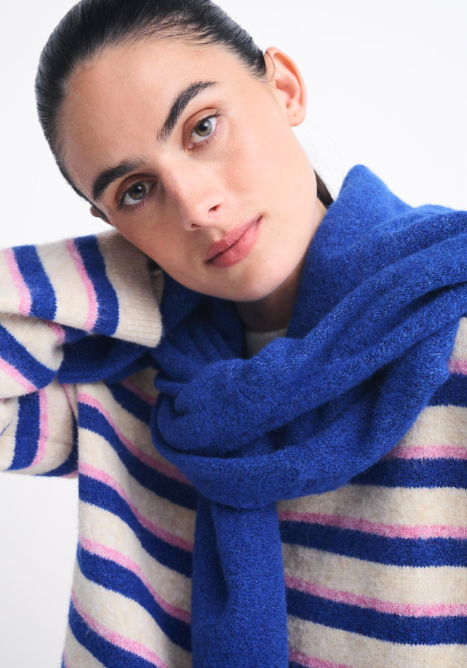Otto Knit Pink Cobalt Stripe Little Lies — close-up portrait of model wearing cream, cobalt and pink striped boxy knit with a cobalt blue scarf draped around the neck, available in Australia at Kat and Ko Clothing