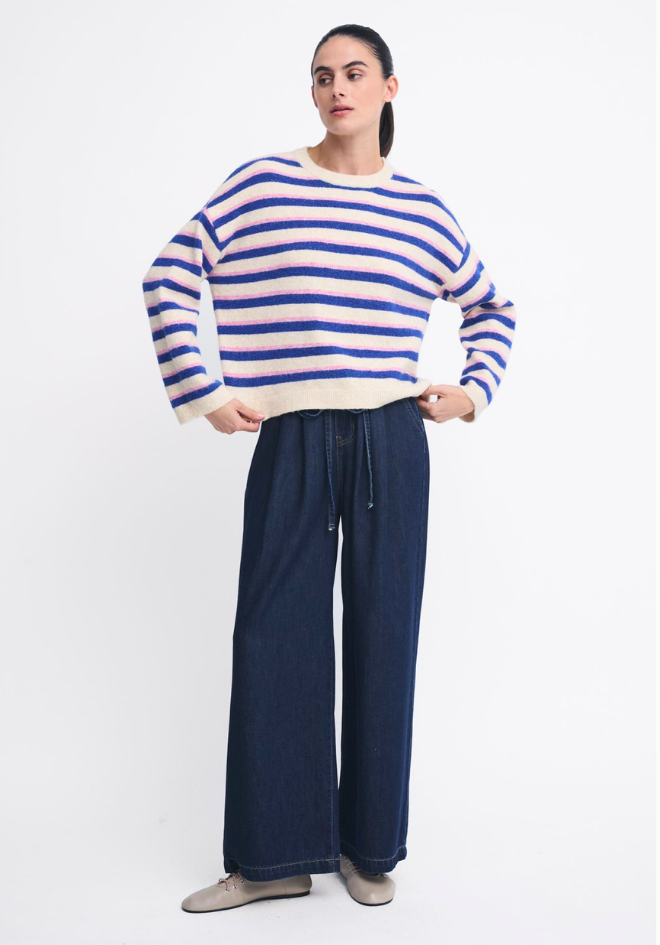 Little Lies Otto Knit Pink Cobalt Stripe — studio three-quarter view of relaxed boxy striped knit in cream, cobalt and pink with dropped shoulders and slightly cropped length, styled with dark navy wide-leg pants, available in Australia at Kat and Ko Clothing